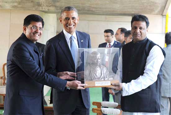 US President Barack Obama being presented a bust of Mahatma Gandhi by Power Minister Piyush Goyal at Rajghat 1 goyal-obama