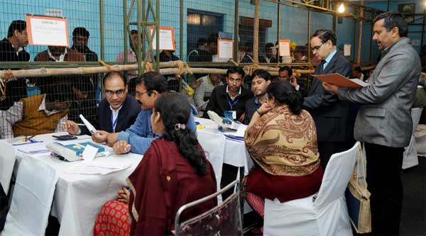 The Electoral officials counting votes for the Delhi Assembly Election, at a centre, in New Delhi on February 10, 2015. 1 The Electoral officials counting votes for the Delhi Assembly Election, at a centre, in New Delhi on February 10, 2015.